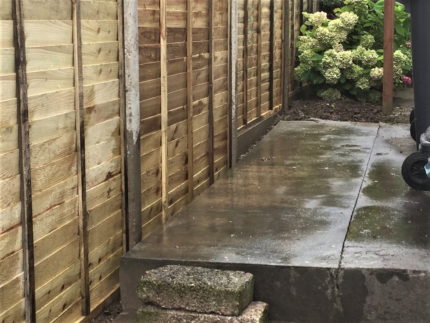 Concrete slab cut to size for new fence